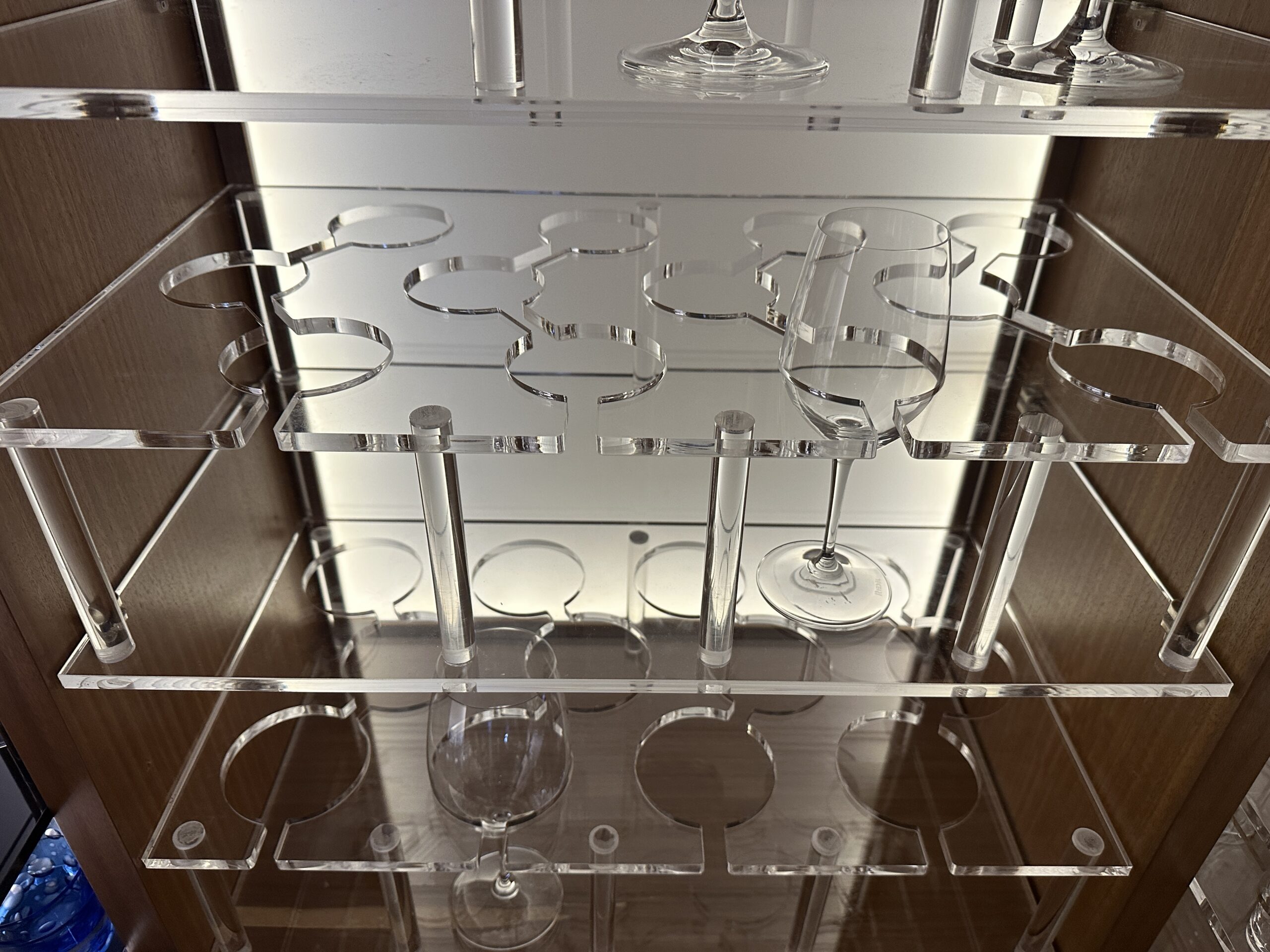 "Clear acrylic perspex glass shelving with displayed cutlery set"