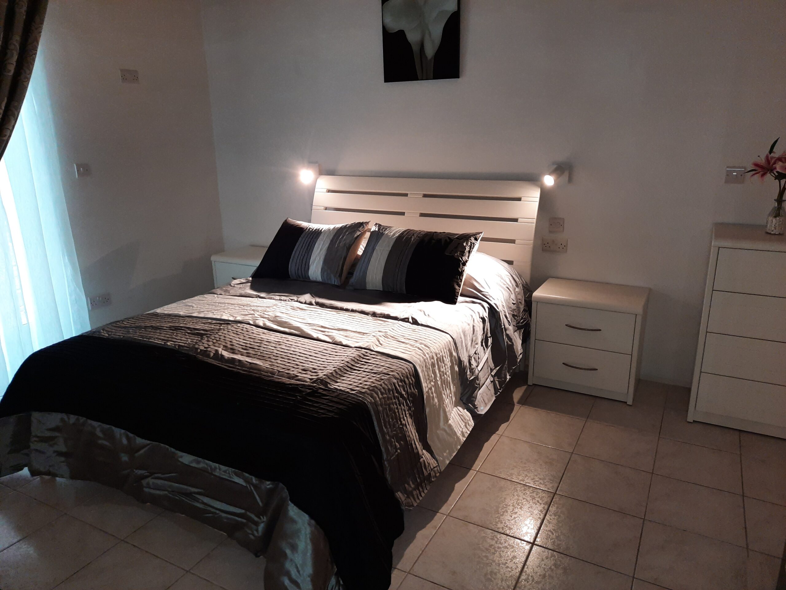 "Custom bedroom furniture set in Malta, featuring elegant design."