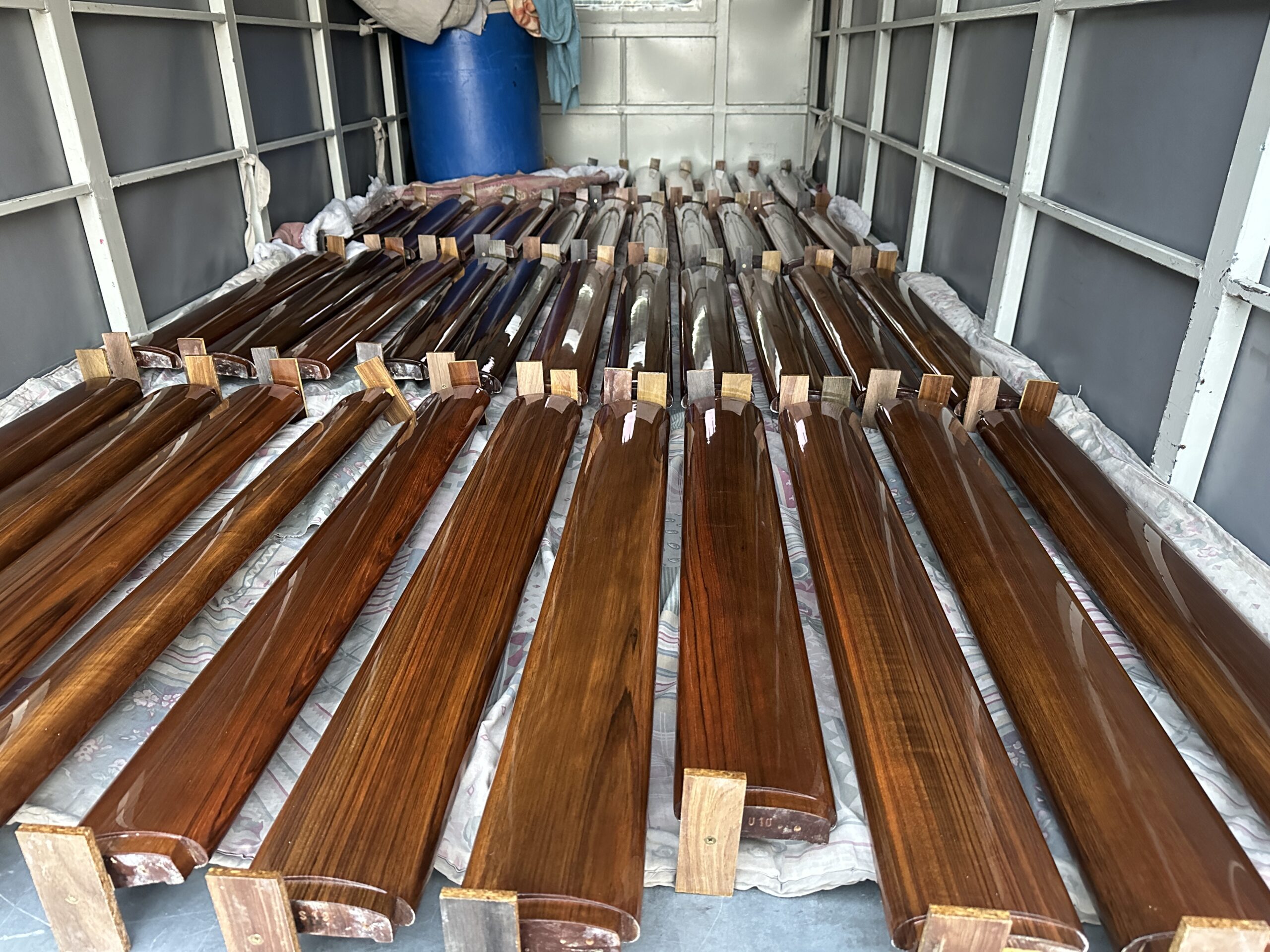 "Custom teak capping rails on a boat in Malta"