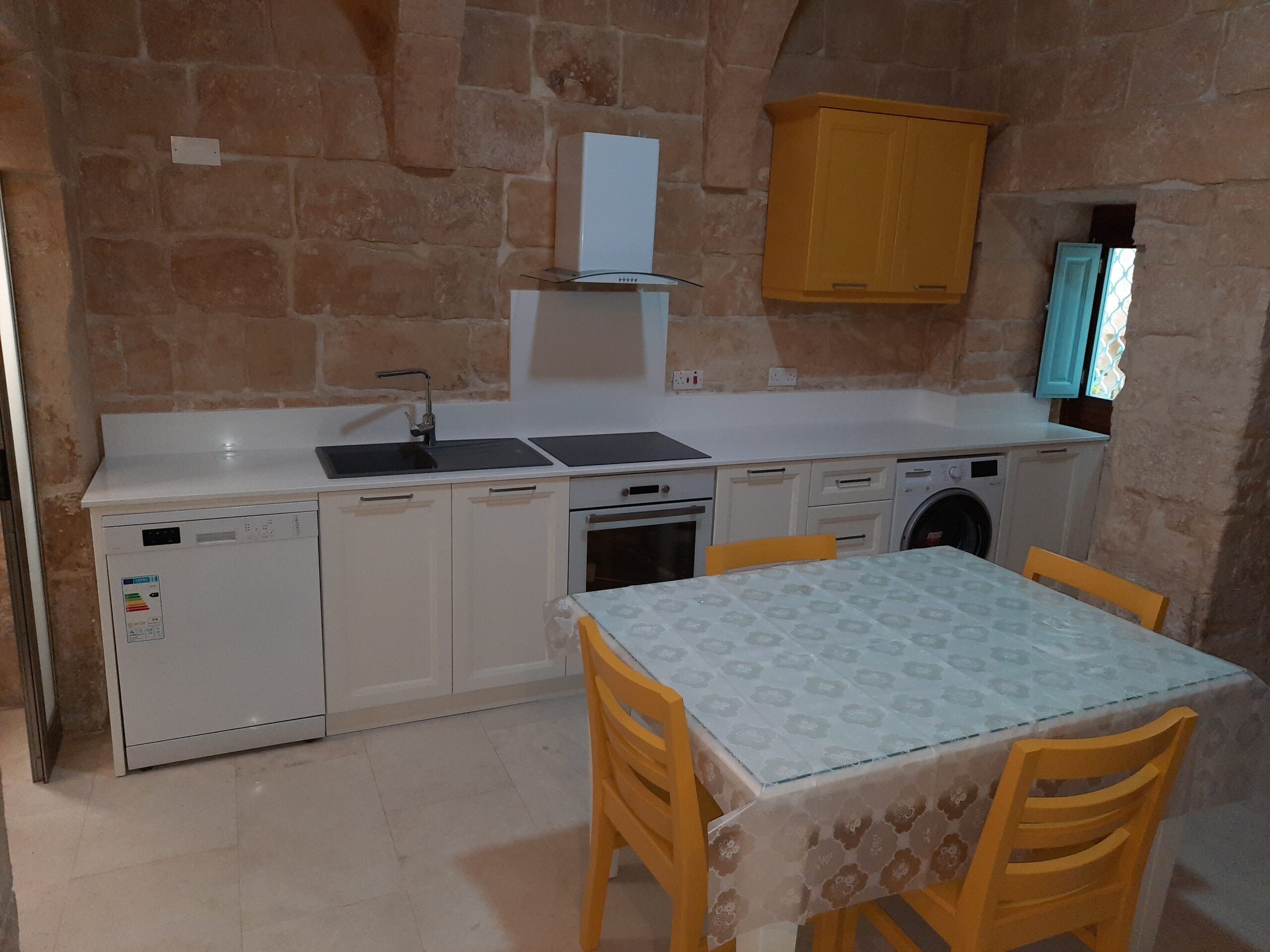 "Modern wooden kitchen design in Malta with sleek cabinetry."
