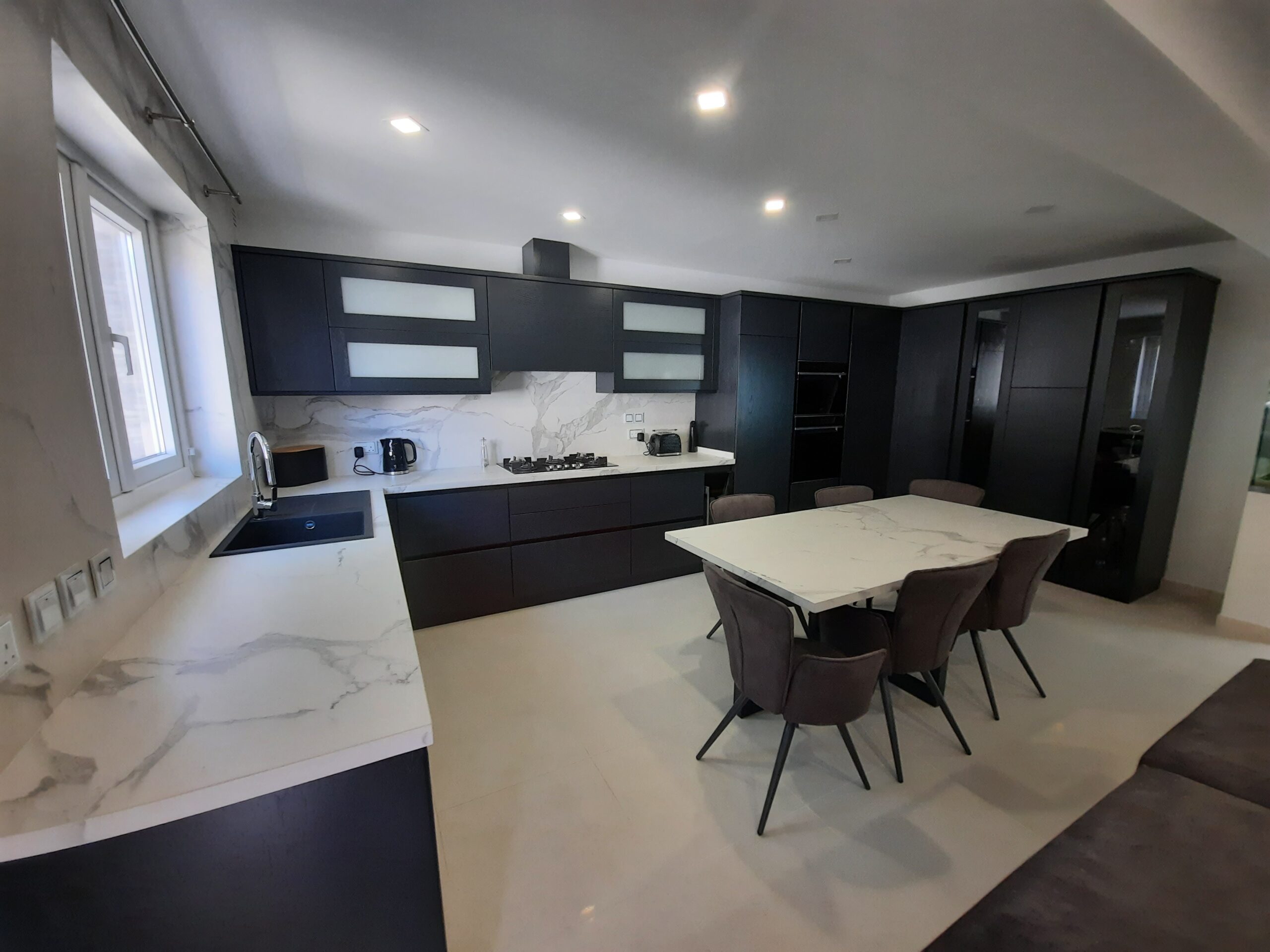 Alt text: "Traditional wood kitchen cabinets in Malta"